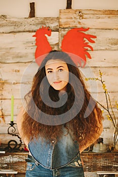 Portrait of a girl with long, curly, natural hair. Red