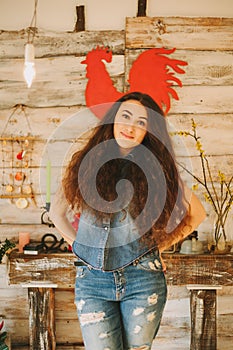 Portrait of a girl with long, curly, natural hair. Red