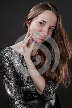 Portrait of girl with long hair and with long color fingernails