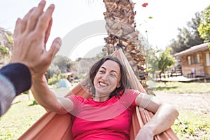 Portrait of a girl lying in a hammock