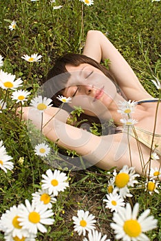 The portrait of girl in the middle of flower