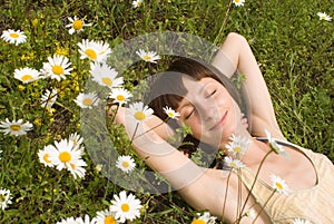 The portrait of girl in the middle of flower