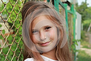 Portrait of a girl in nature in the village