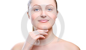 Portrait of girl with nude make-up with hands on chin.