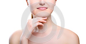 Portrait of girl with nude make-up with hands on chin.