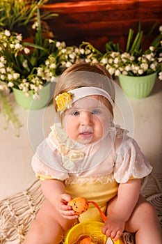 Portrait girl one year old shooting in the studio in the background flowers wooden background dekor photo