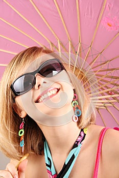 Portrait of girl with pink umbrella