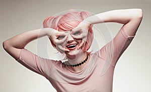 Portrait of girl in pink wig