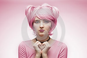 Portrait of girl in pink wig