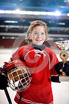 Portrait of girl player ice hockey winner trophy