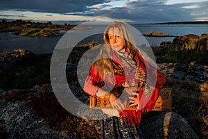 Portrait of a girl playing the gusli in Rabocheostrovsk, Republic Kareliya