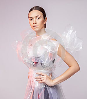 Portrait of a girl in polyethylene. Fashion portrait