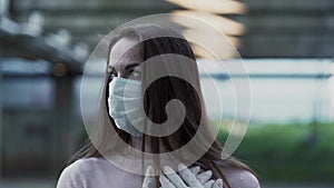 Portrait of a girl in a protective mask a great fright from the coronavirus