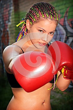 Portrait of a girl with red boxing gloves