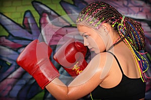 Portrait of a girl with red boxing gloves