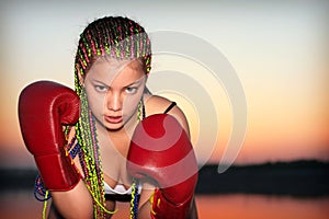 Portrait of a girl with red boxing gloves