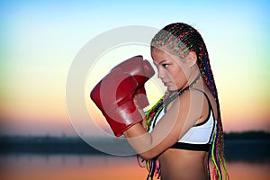 Portrait of a girl with red boxing gloves
