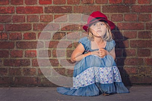 Portrait of a girl with a red hat