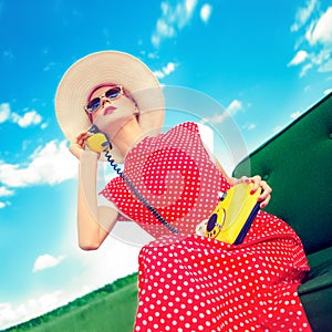 portrait of a girl in a retro style with a phone