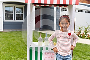 Portrait Of Girl Running Homemade Lemonade Stand