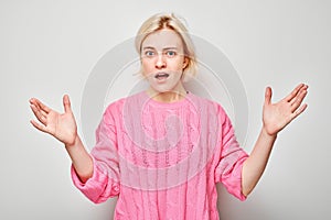 Portrait of girl screaming with anger, freaking out, breakdown on white background. Depression, uncertainty, nervous