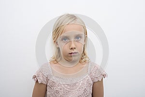 Portrait of girl staring over white background