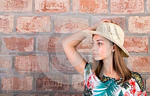 Portrait of a girl in a straw hat