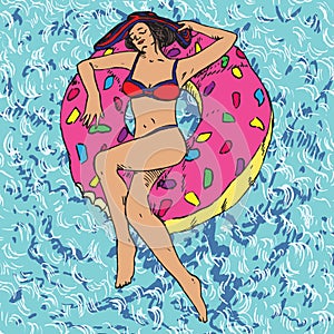 Portrait of girl in striped hat and bikini sunbathing on pink donut inflatable ring, blue clean water waves background