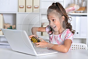 Portrait of girl studing with laptop at classroom