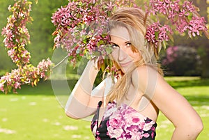 Portrait of a girl under a cherry blossom tree