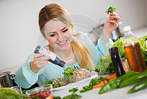 Portrait of girl with vegetable salad and balsamico