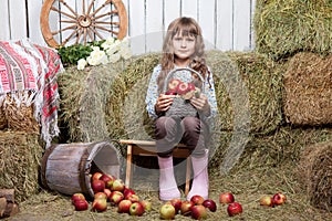 Portrait of girl villager with basket of apples