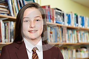 Portrait Of Girl Wearing School Uniform In Library