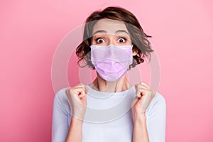 Portrait of girl win lucky gift raise fists scream wear flu mask good look pullover isolated over pink color background