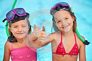 Portrait, girls and happy kids with thumbs up at swimming pool, sisters or family of siblings in swimsuit outdoor