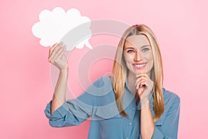Portrait of glad positive woman with long hairstyle dressed blue shirt hold dialog cloud hand touch chin isolated on