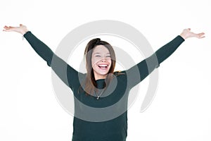 Portrait of glad student funny girl with arms up celebrating victory yelling with wide open mouth isolated on white background