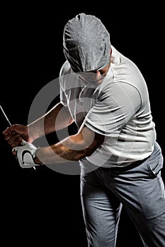 Portrait of golf player taking a shot