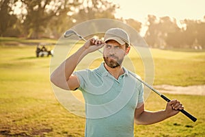portrait of golfer in cap with golf club in cap, sport