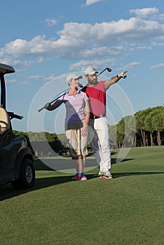 Portrait of golfers couple on golf course