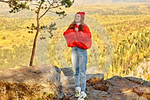 Portrait of good-looking fit redhead woman is travelling on mountains