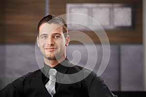 Portrait of goodlooking businessman smiling