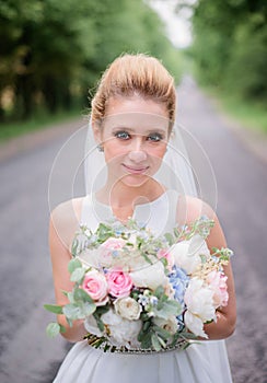 Portrait of a gorgeous bride with tender skin and deep blue eyes