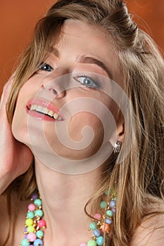 Portrait of happy young adult charming blonde girl close-up