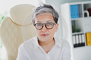 Portrait of gorgeous closeup picture of nice pretty mature woman gray hair stylish glasses indoors isolated on office