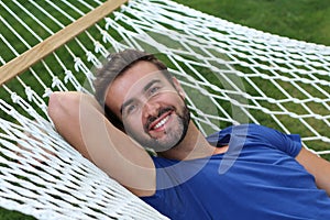 Portrait of a gorgeous man laying on a hammock