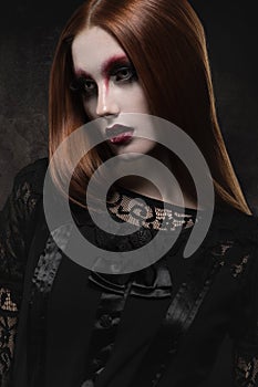 Portrait of gothic girl with black eyes