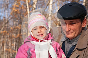 Portrait of grandfather with granddaughter