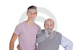 Portrait of grandfather and his teen grandson smiling
