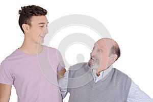 Portrait of grandfather and his teen grandson smiling